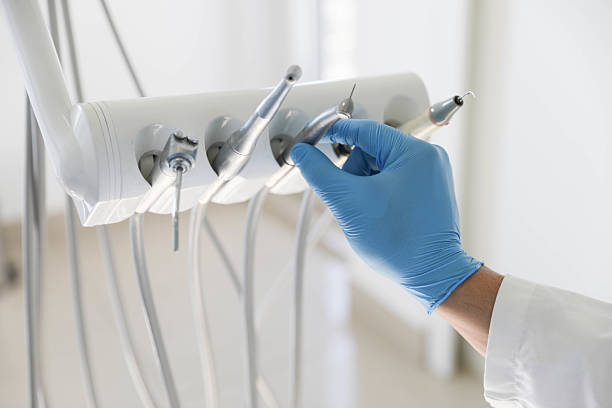 Professional Tooth Extraction technician working in Airport, CA